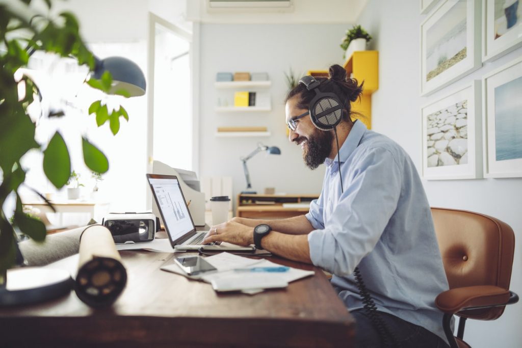 man working in a cosy home office space created from home extension